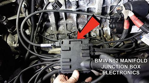 Junction box under intake manifold 